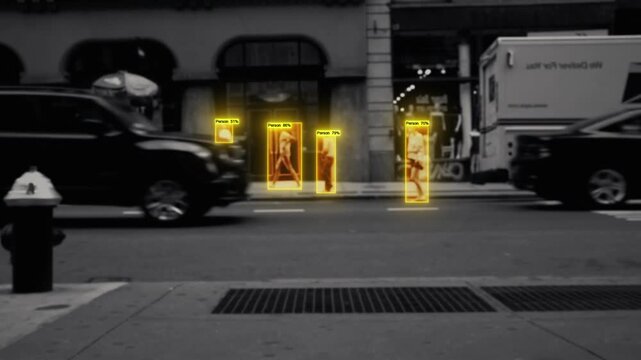 Urban pedestrian detection with AI system showing yellow tracking boxes and confidence percentages for each person walking on street. Computer vision person tracking technology.