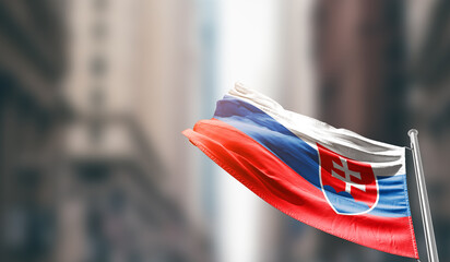 Slovakia national flag waving on street. A beautiful with mast with blur buildings. Slovakia national flag for independence day.