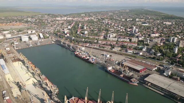 Aerial panorama Poti cityscape, black sea port, residential blocks, mixed uses, roads and parks, waterfront real estate, summer daylight panorama