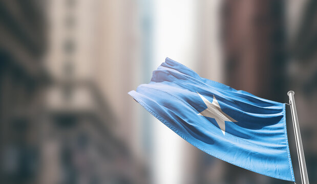 Somalia national flag waving on street. A beautiful with mast with blur buildings. Somalia national flag for independence day.