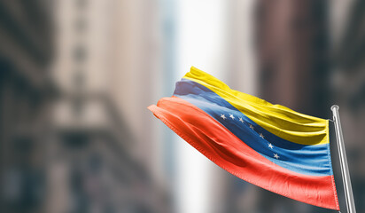 Venezuela national flag waving on street. A beautiful with mast with blur buildings. Venezuela national flag for independence day.