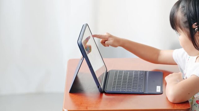 Girl using a tablet in the classroom