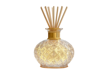 A gold and crystal vase with a wick in it. The vase is decorated with a pattern of diamonds