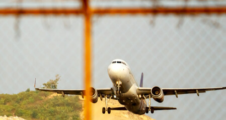Plane taking off during sunset