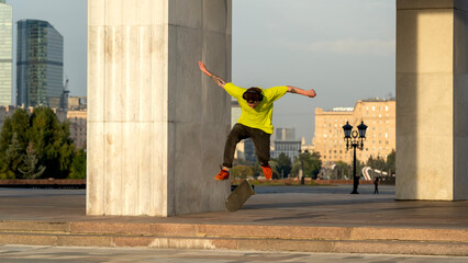 Skateboarder riding a skateboard and doing tricks