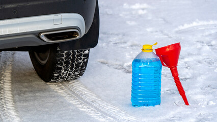 Car on winter tires on snow. Winter tyre tread on snow