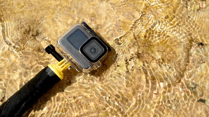Action camera in water in bright sun