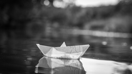 Paper boat on the water