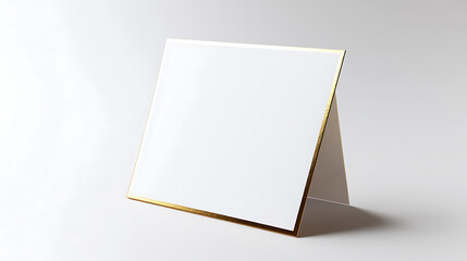 Elegant white card with gold trim, perfect for invitations or announcements. Minimalist design offers sophistication for any occasion. Copy space available.