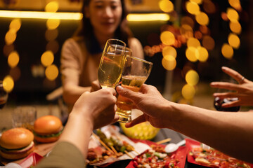 Cheers to friendship and good times with glasses of wine at table, Happy celebrating with food and drink.
