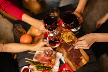 Party and celebration concept, Holidays summer, Group of friends clinking glasses wine on outdoor at night party.