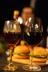Red and white wine glasses on a beautifully set table, Fine dining and wine, Luxury table setting.
