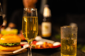 Party and celebration concept, Holidays summer, Group of friends clinking glasses with wine on outdoor at night party.