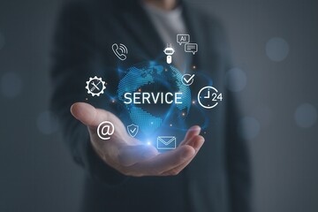 Customer service technology with holographic icons,hand holding digital globe with service symbols,24 hour support,AI automation and innovation for modern business assistance solutions