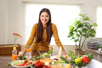 Happy young woman enjoying delicious homemade pizza at home.