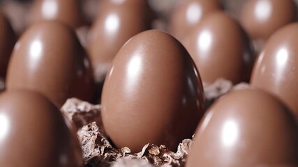 A close-up shot of several chocolate eggs, great for easter or spring themes