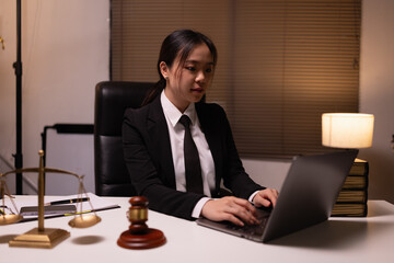 Female lawyer in office, Corporate lawyer at workspace, Attorney with legal books and gavel,