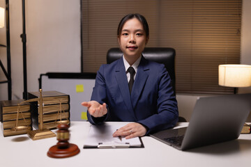 Female lawyer in office, Corporate lawyer at workspace, Attorney with legal books and gavel,