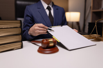 Lawyer businesswoman working diligently with signature document in a modern office, Signing...