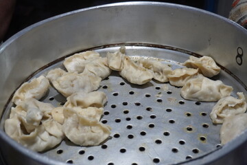 Steamed Momos in Metal Pan Dumpling Preparation