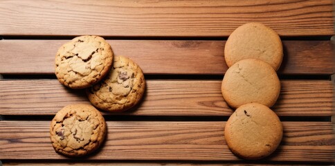 Top View of Chocolate Chip and Sugar Cookies on Rustic Wooden Surface