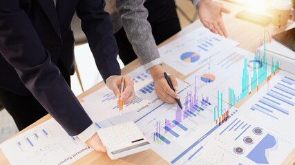 Team analyzing financial data and creating business strategies using digital tools.