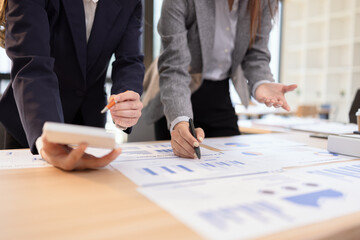 Team analyzing financial data and creating business strategies using digital tools.