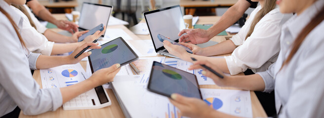 Team analyzing financial data and creating business strategies using digital tools.