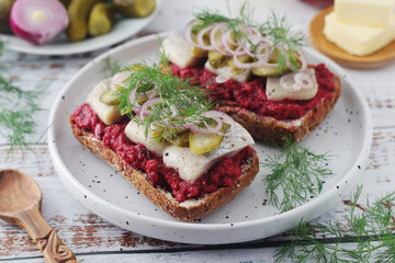 Scandinavian sandwiches with herring and beetroot