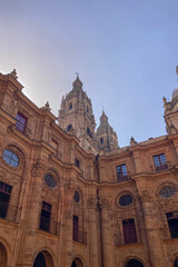 Salamanca University with its historic facade and ornate Plateresque architecture under a bright sky in Salamanca, Spain