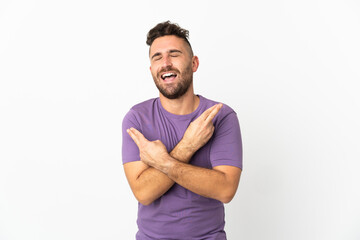 Fototapeta premium Caucasian man isolated on white background smiling and showing victory sign