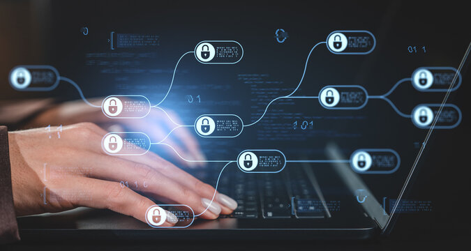 Cybersecurity blockchain concept with hands typing on laptop and digital security locks overlayed on dark tech background with glowing interface elements. - Powered by Adobe