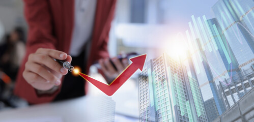Hand of businesswoman holding a pen, discussing marketing analytics at the office.