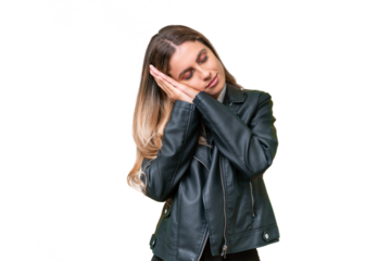 Business pretty Uruguayan woman wearing a biker jacket over isolated background making sleep gesture in dorable expression