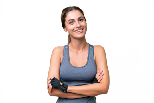 pretty Sport Uruguayan woman over isolated background keeping the arms crossed in frontal position