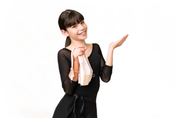 Little caucasian girl practicing ballet over isolated background extending hands to the side for inviting to come