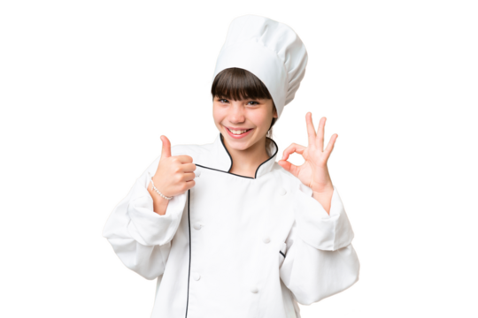 Little caucasian chef girl over isolated background showing ok sign and thumb up gesture