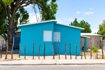 Pedernales, Dominican Republic, 8 august 2025. Typical Dominican Caribbean house made of wood, painted a bright blue color.