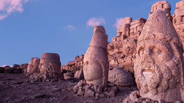 Antique ruined statues on Nemrut mountain in Turkey. Ruins at the top of Mount Nemrut. Destroyed ancient statues in the Taurus Mountains. Ancient stone heads on top of Mount Nemrut. Eastern Anatolia