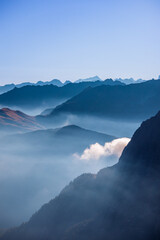 Mountain landscape in the Alps above the clouds