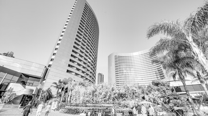 San Diego - July 30, 2017: Tourists, streets and buildings along Seaport Village and Embarcadero Park
