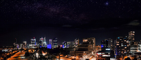 Downtown Perth skyline captured from above at night showing illuminated towers and urban landscape