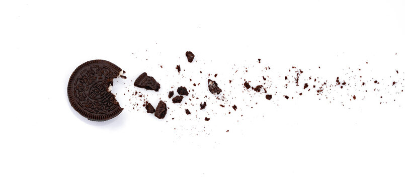 Delicious Oreo biscuits with chocolate and cream on white background	
