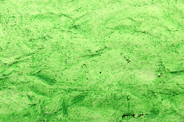 green plaster background with texture