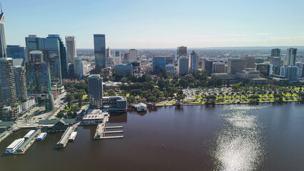 Fototapeta premium Aerial view of Perth skyline from Swan River with clear blue sky and sunny day reflections
