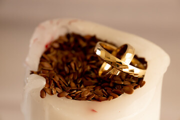 Gold Wedding Rings in Soft Light &ndash; Wax Anniversary Concept. Close-up of gold wedding rings in warm, diffused light creating an intimate and emotional atmosphere connected with wax wedding anniversary 
