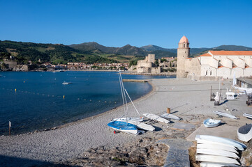 View of colourful Collioure, narrow streets and yellow, pink, orange houses, summer vacation...