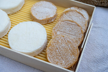 Rocamadour white and aged soft goat AOC cheese with soft rind produced on farm in Perigord and Quercy takes its name from village of Rocamadour in departement Lot, France close up
