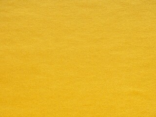 A radiant expanse of goldenrod, the textured surface shines with optimism and the warmth of sunlight