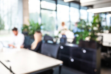 Blurred office background with employees